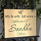 Laser-cut Ek Onkar house number sign with Punjabi religious symbol design.