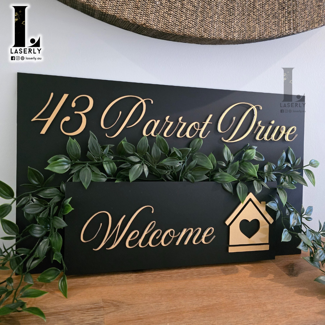 Contemporary house number sign combined with a stylish planter box on exterior wall.