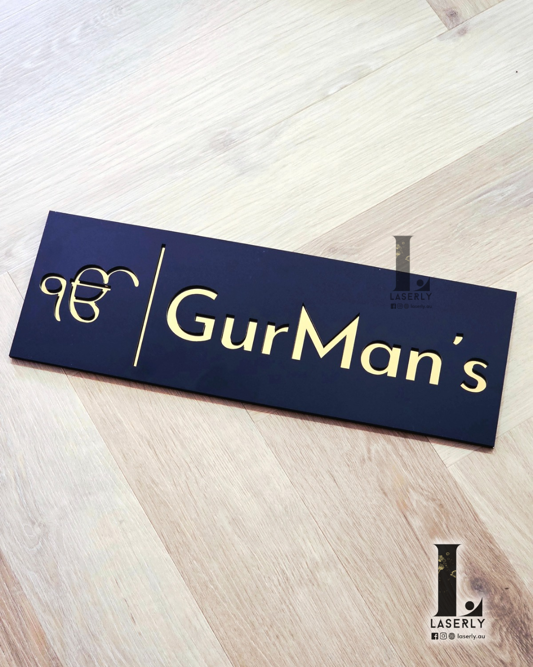 Luxury Ek Onkar house wall plaque featuring mirror gold design on sleek black background.