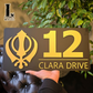 Luxury black and gold Kandha house number sign displayed on exterior wall.