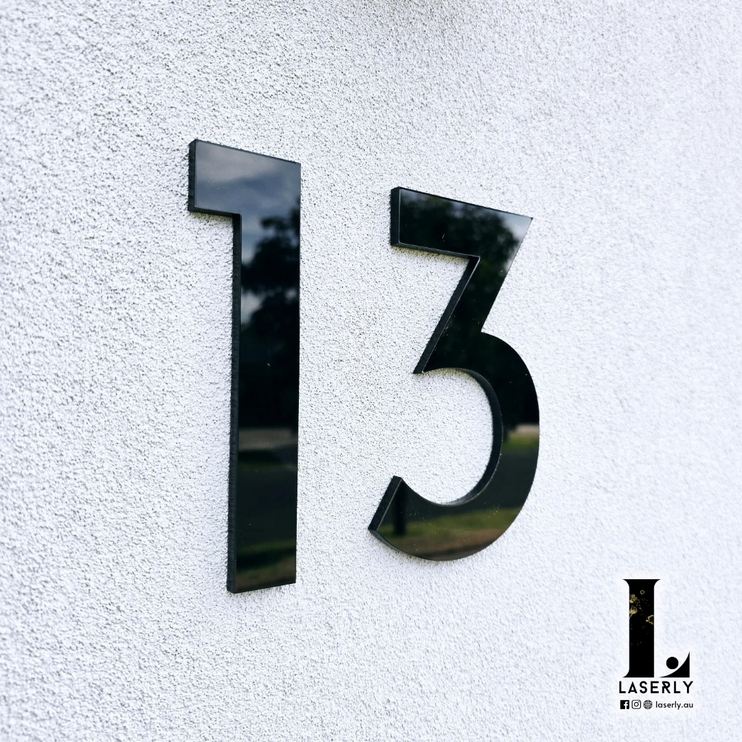 Monochrome house number signage providing a clean, modern look.