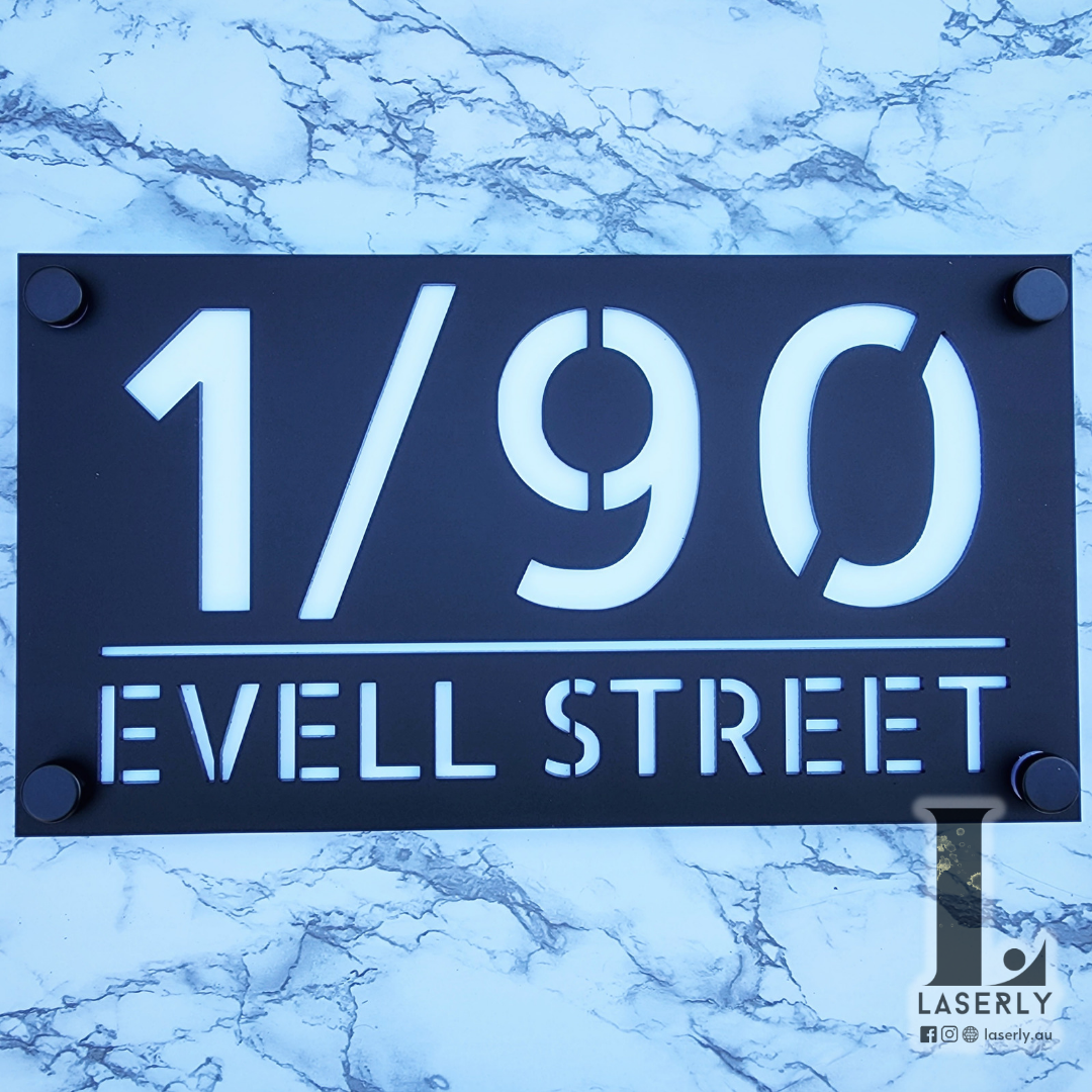 Durable acrylic address sign positioned next to residential front door.