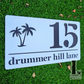 Minimalist palm tree acrylic house number sign, ideal for modern homes.