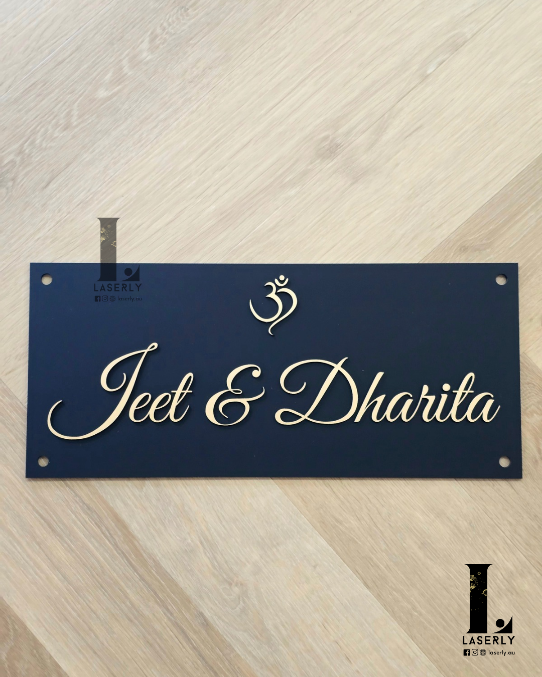 Elegant OM acrylic plaque displaying a home name beside the front door.