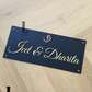 Modern house name sign featuring OM symbol in gold and black acrylic.