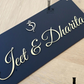 Stylish acrylic OM house number sign adding a touch of divinity to the exterior.