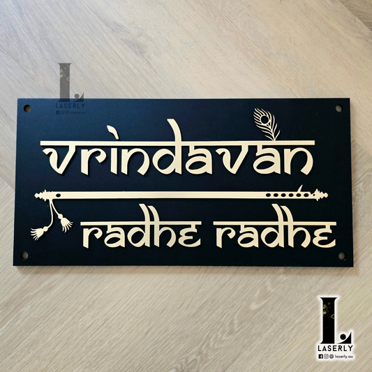 Modern Vrindavan house number sign mounted beside front door with stylish finish.