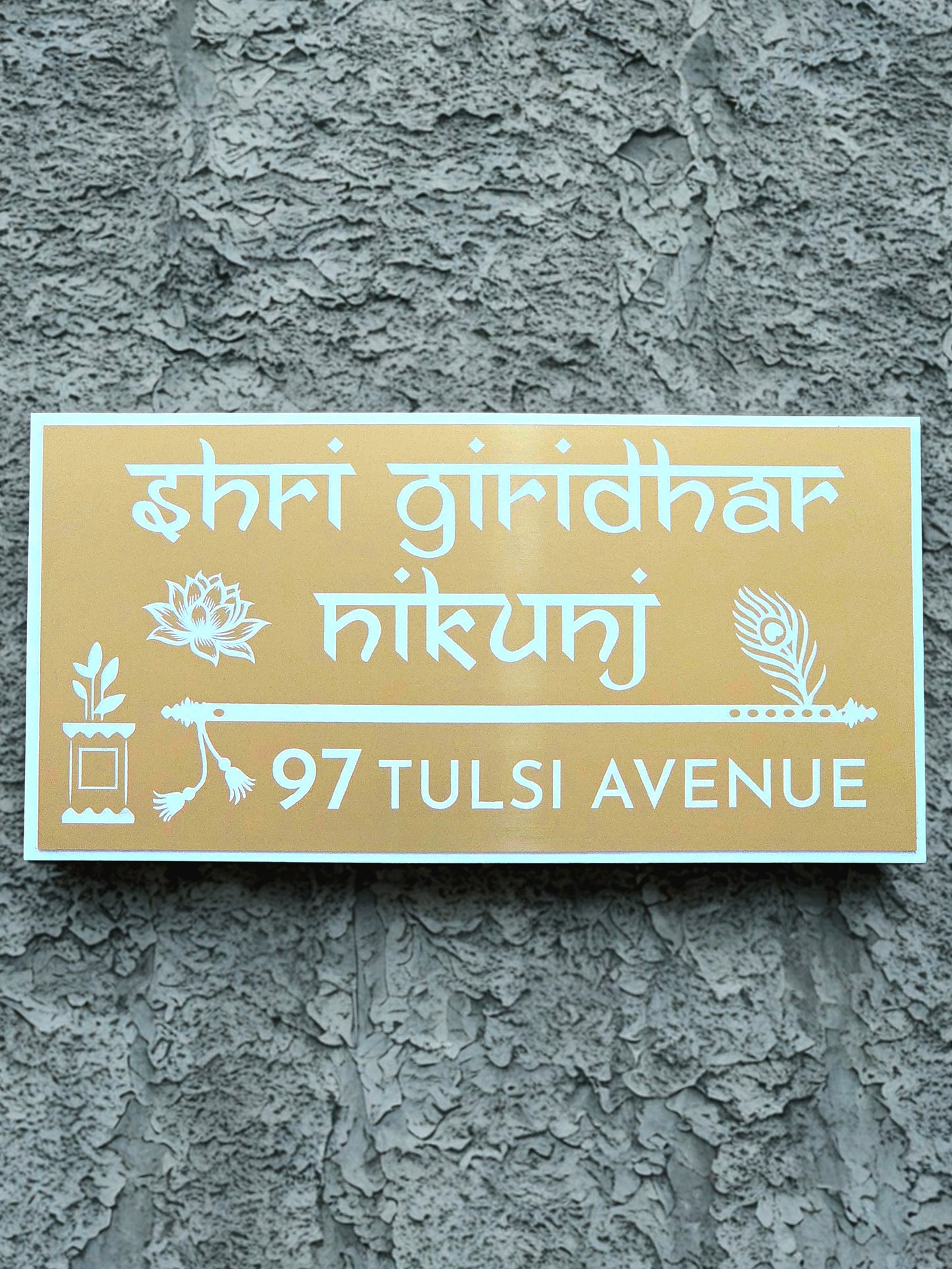 Elegant wall décor showing custom house name with flute and Tulasi design.
