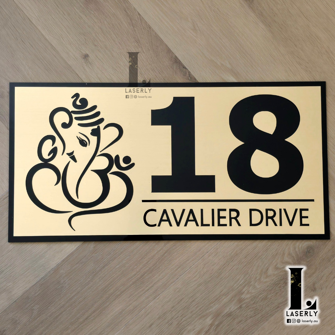 Modern Ganesha house number sign with laser-cut acrylic design mounted beside a front entrance.