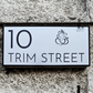 Elegant laser-cut Ganesha house number sign enhancing home entrance décor.