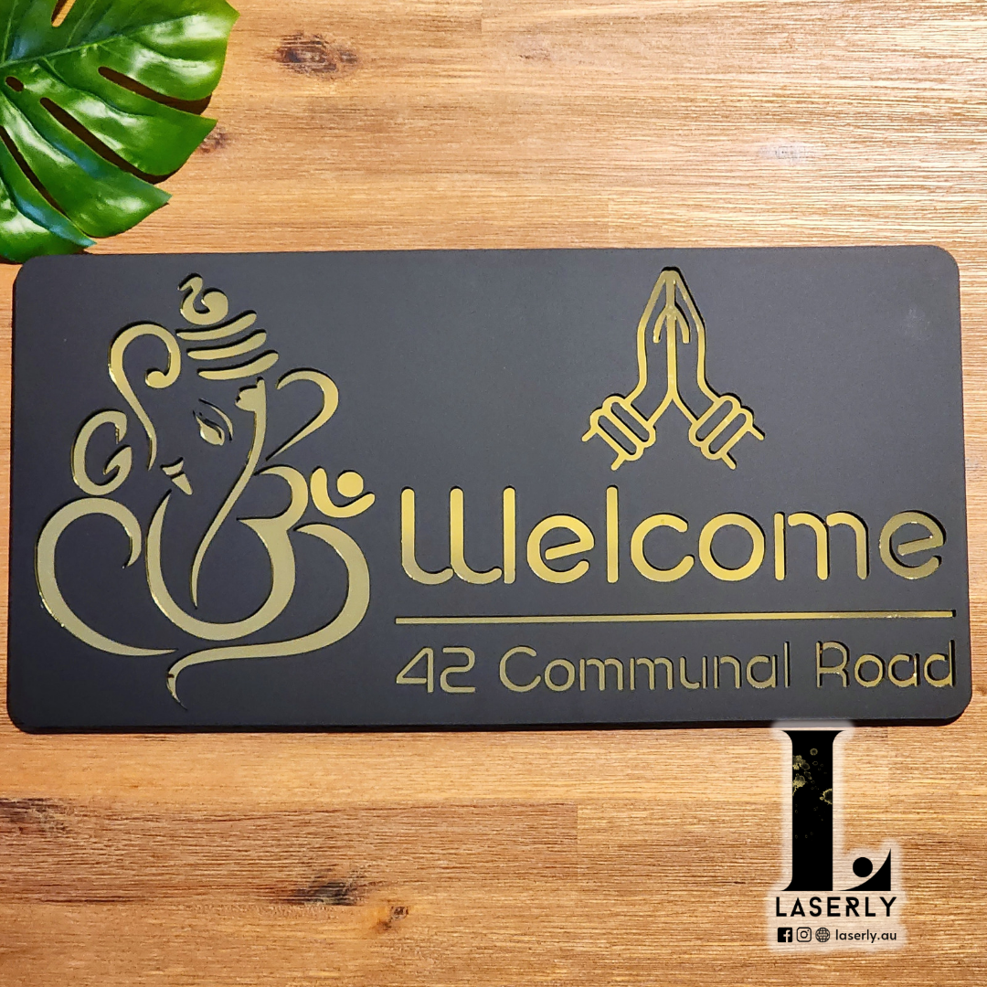 Elegant Ganesha Namaste house number sign in premium acrylic installed near entrance door.