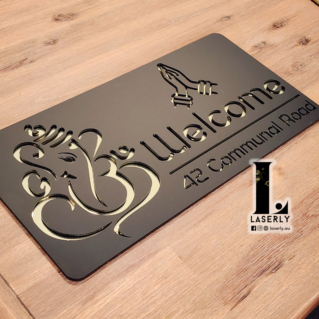 Decorative Ganesha Namaste house number plate combining spiritual motif with contemporary house numbering.