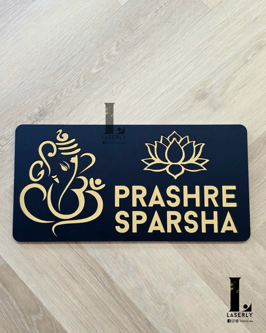 Front view of Ganesha with Kamala house number sign mounted beside entrance.