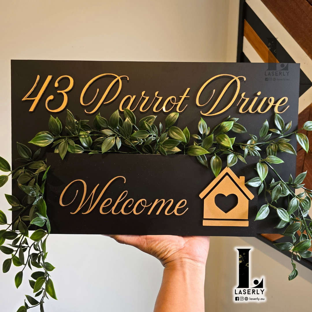 Modern house number planter mounted beside front door with integrated greenery and sleek contemporary design.
