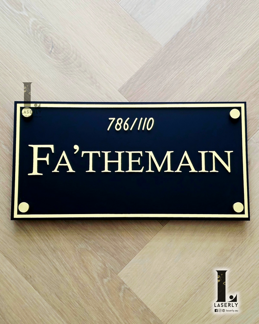 Minimalist acrylic house name sign mounted beside a modern Australian home entrance.
