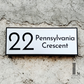 Modern minimalist house number sign in brushed steel look for contemporary homes.