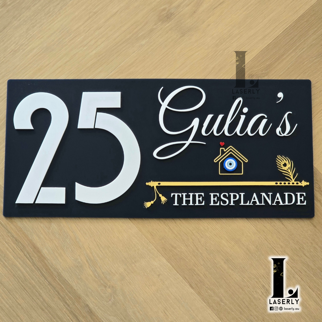 Navy blue house number plaque featuring an evil eye symbol and elegant flute-inspired design in glossy finish.