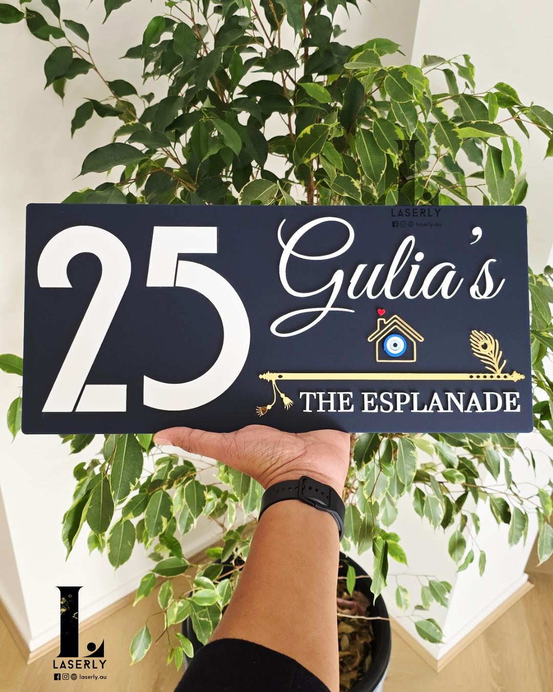 Rectangular navy blue house number plaque with protective evil eye motif and intricate flute pattern.