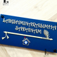 Elegant navy blue plaque displaying house numbers with flute pattern and protective evil eye.