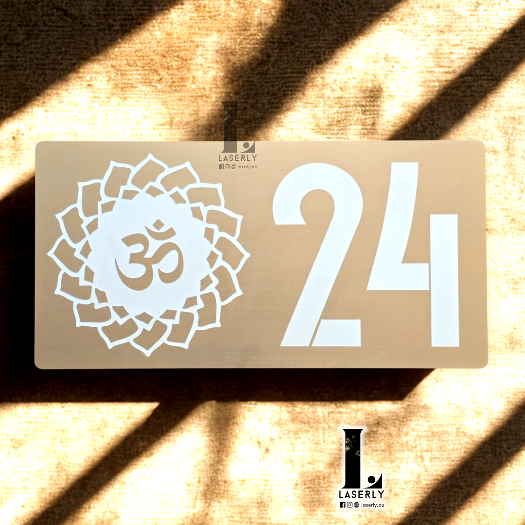 OM Mandala house number sign with intricate circular mandala design and laser-cut acrylic finish mounted beside the front door.