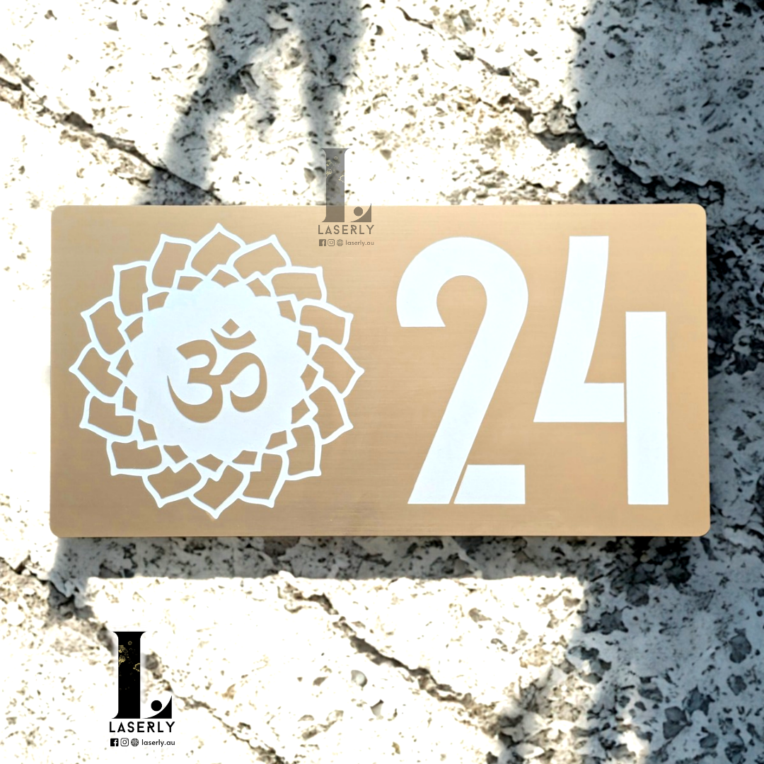 Decorative OM Mandala house number plaque featuring detailed spiritual patterns and modern acrylic styling on exterior wall.