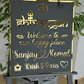 Laser-cut Om Shiva house number sign in black and gold finish on home façade.