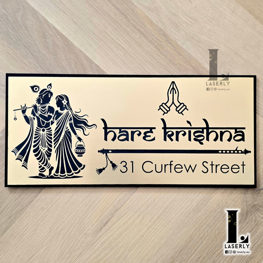 Radhe Krishna house number sign featuring elegant laser-cut design mounted beside the main entrance door.