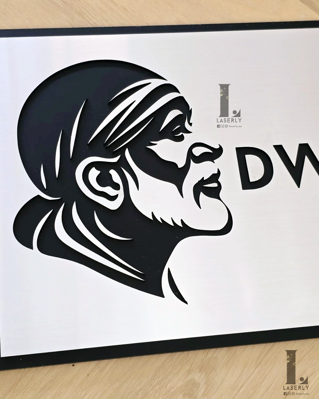 Decorative Saibaba house number sign in silver and black for home exteriors.