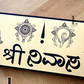 Close-up of Srinivasa house number sign with sleek gold and black design.