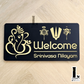Srinivasa house number sign in laser-cut acrylic mounted beside a modern home entrance.