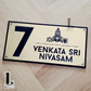 Stylish Thirumala house number plate enhancing the entrance of a home.