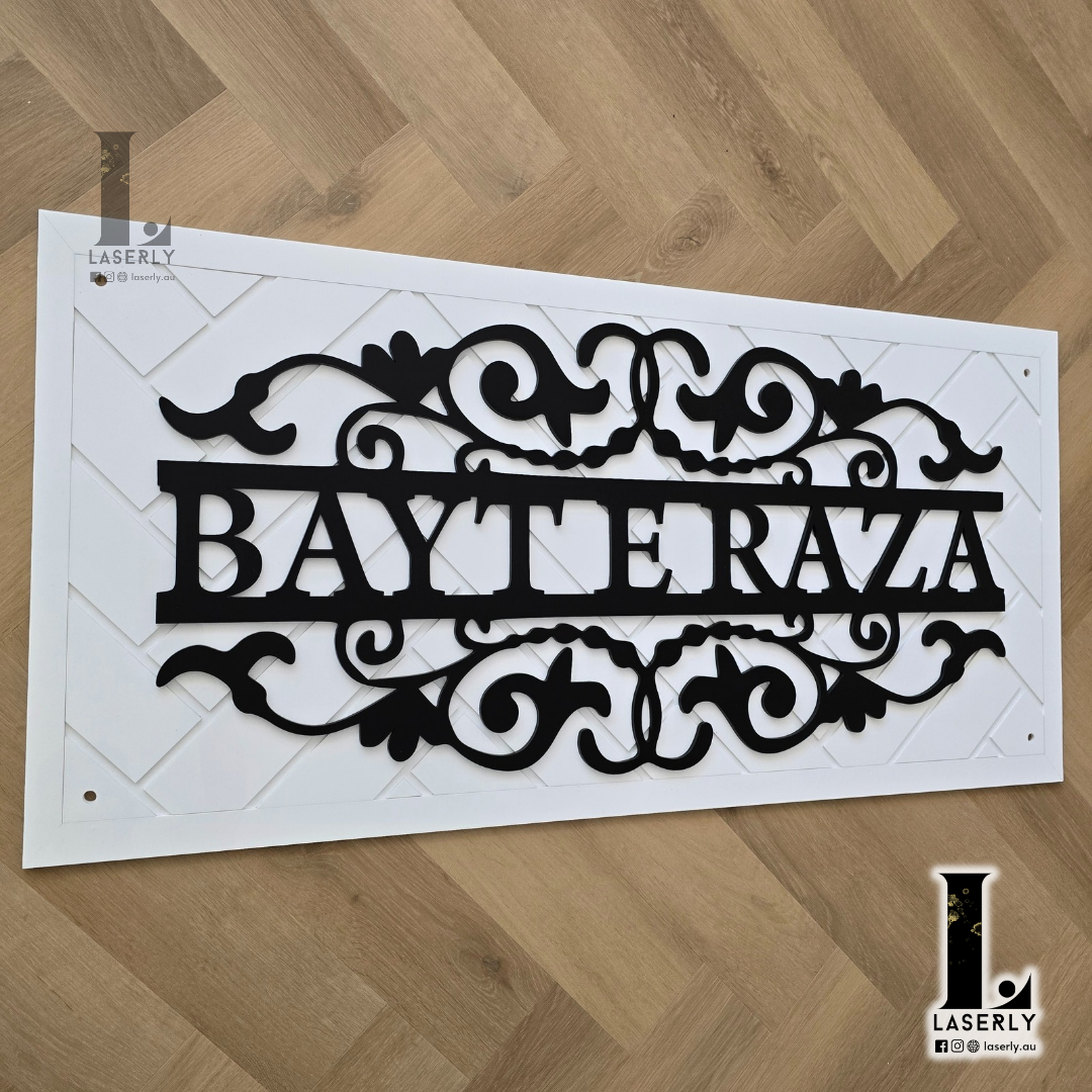 Minimalist white patterned name plaque enhancing the aesthetic of a modern home.