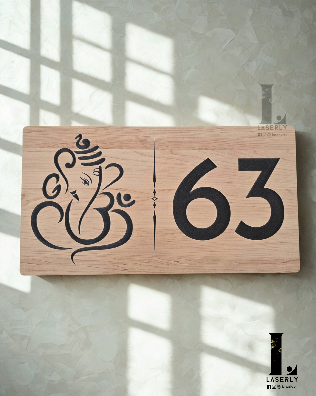 Elegant Ganesha house number sign with a wooden finish displayed on an exterior wall.